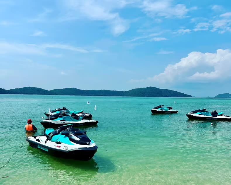 Jet skis parked in turquoise water
